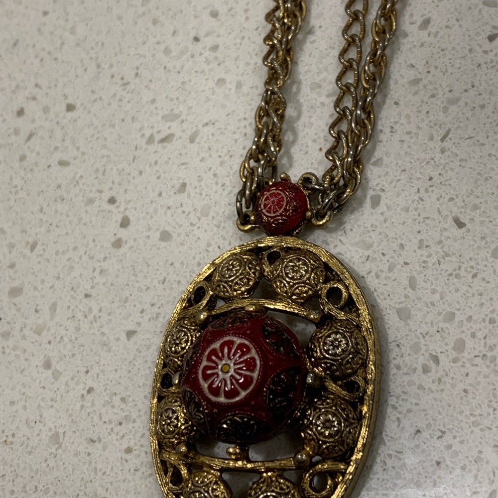 Ornate Gold and Red Pendant Necklace with Intricate Design